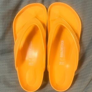 Birkenstock Vibrant Orange Flip Flops